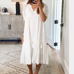 White eyelet dress. High low with puff sleeves.